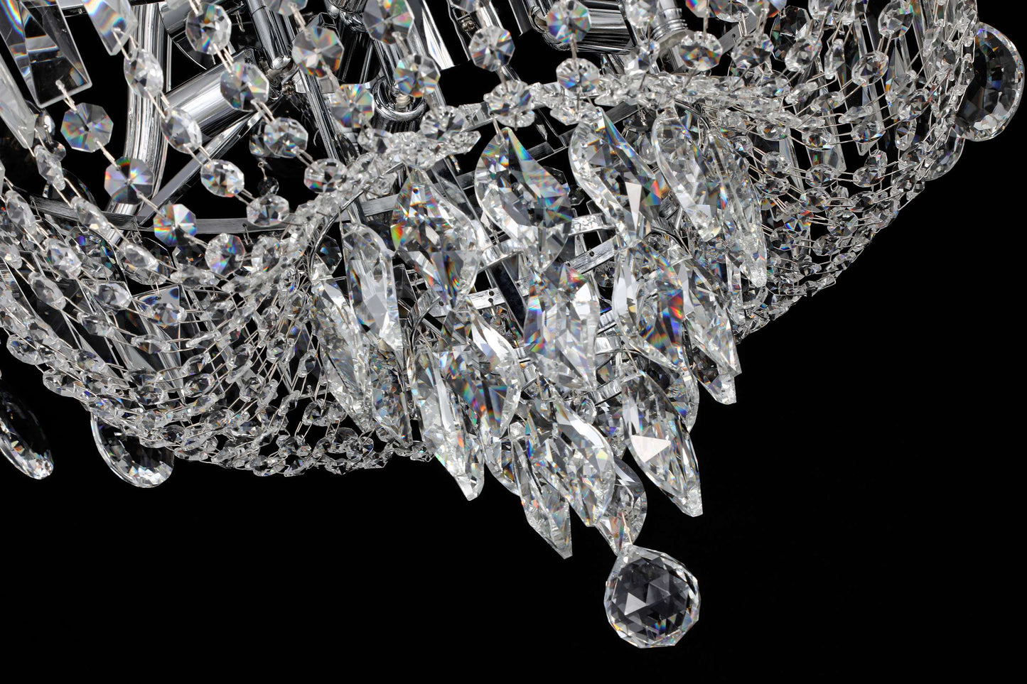 35 inch Close-up of chrome crystal chandelier featuring tiered crystal strands and reflective brilliance.
