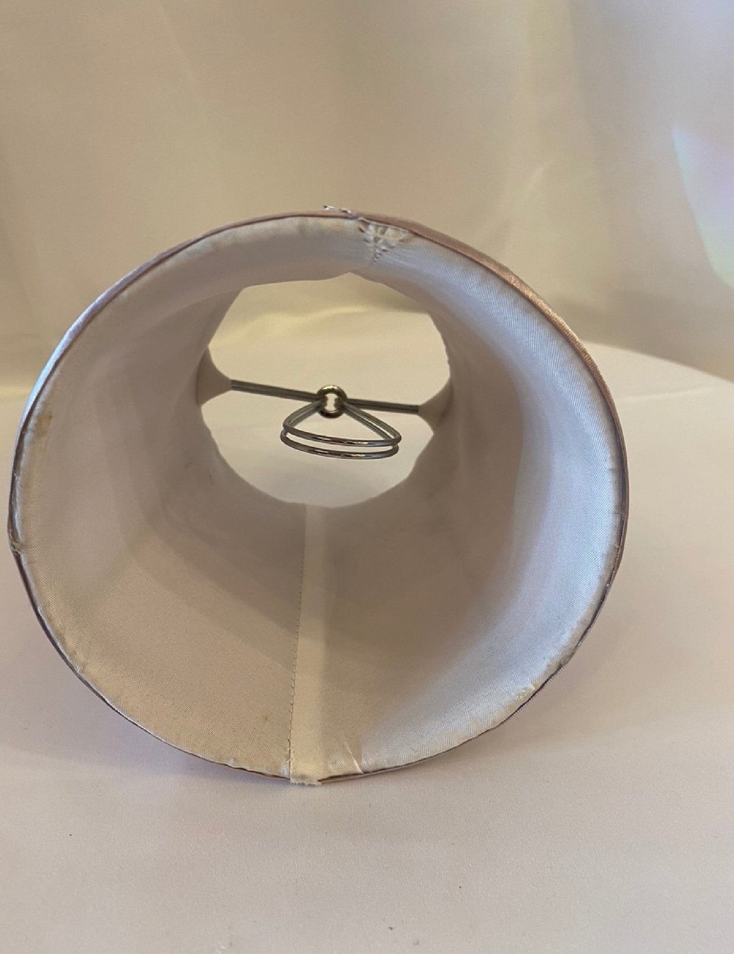 Interior view of pink satin fabric lamp shade