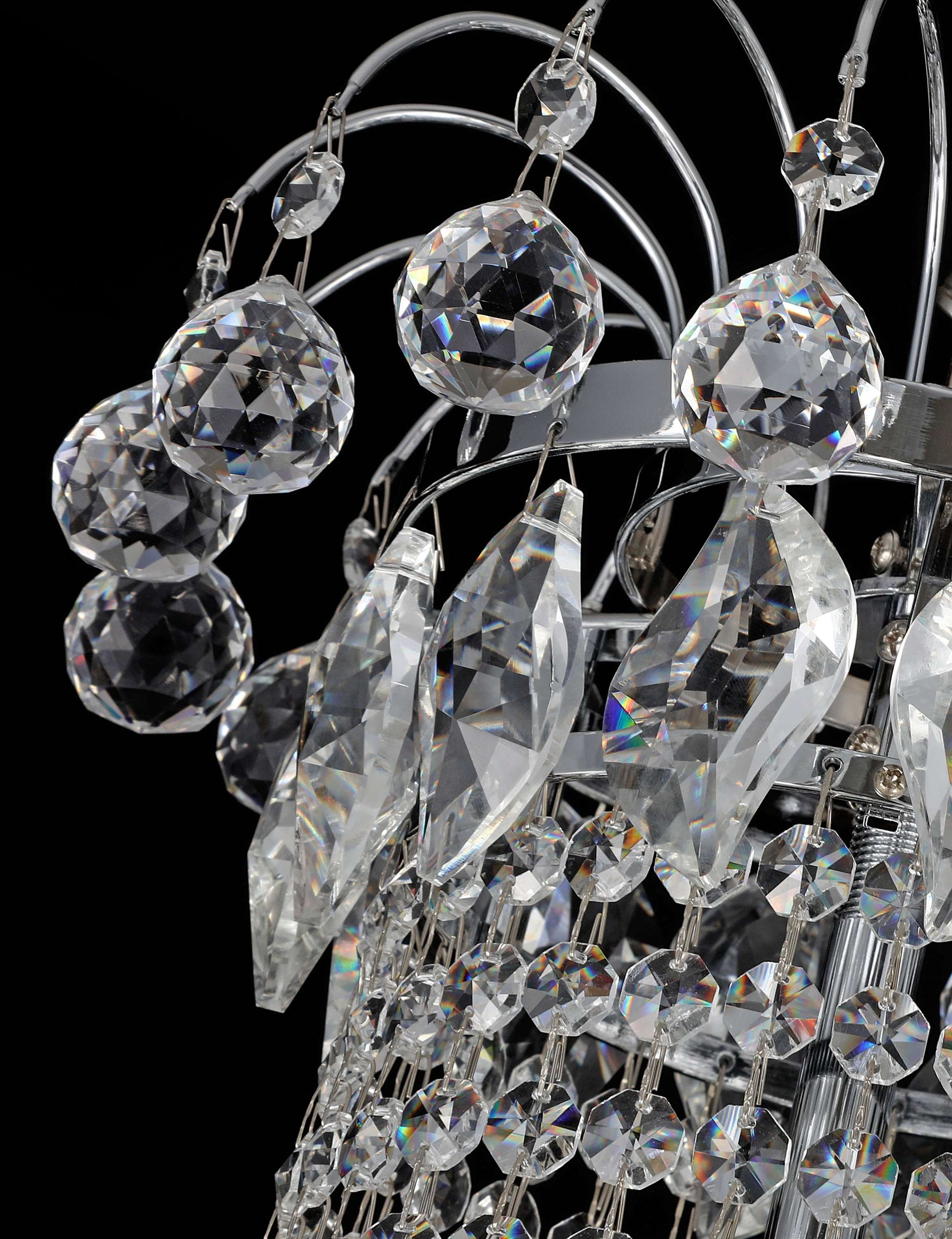 Precision-cut crystal detailing of chrome chandelier showcasing light refraction and clarity.
