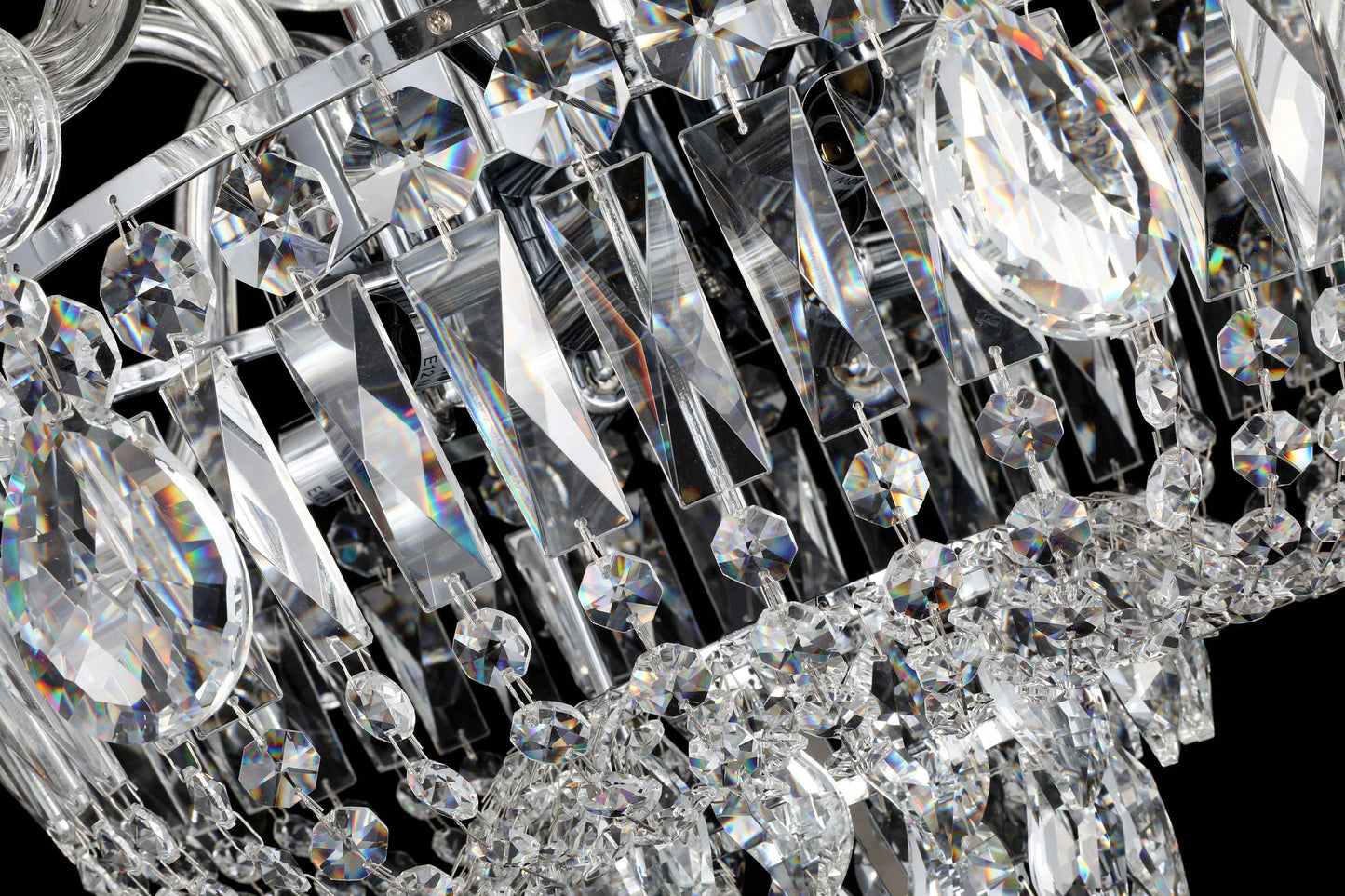 tear drop Precision-cut crystal detailing of chrome chandelier showcasing light refraction and clarity.