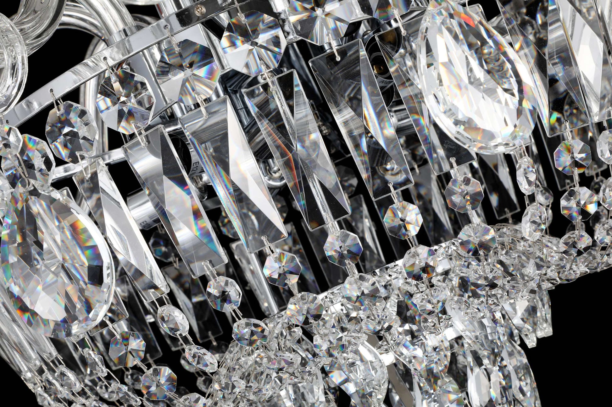 tear drop Precision-cut crystal detailing of chrome chandelier showcasing light refraction and clarity.