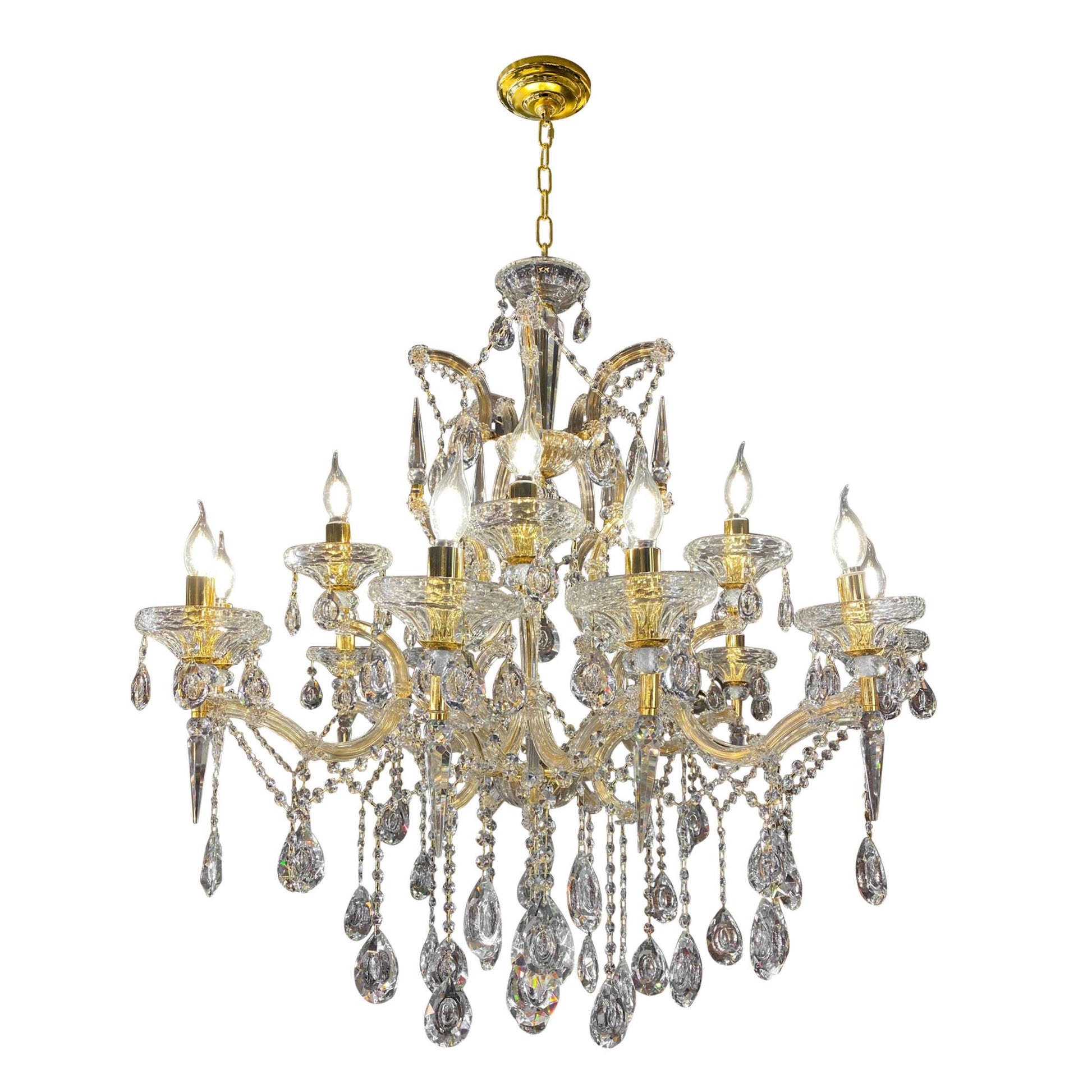 Close-up of 30% full-lead teardrop crystals on gold Maria Theresa chandelier.