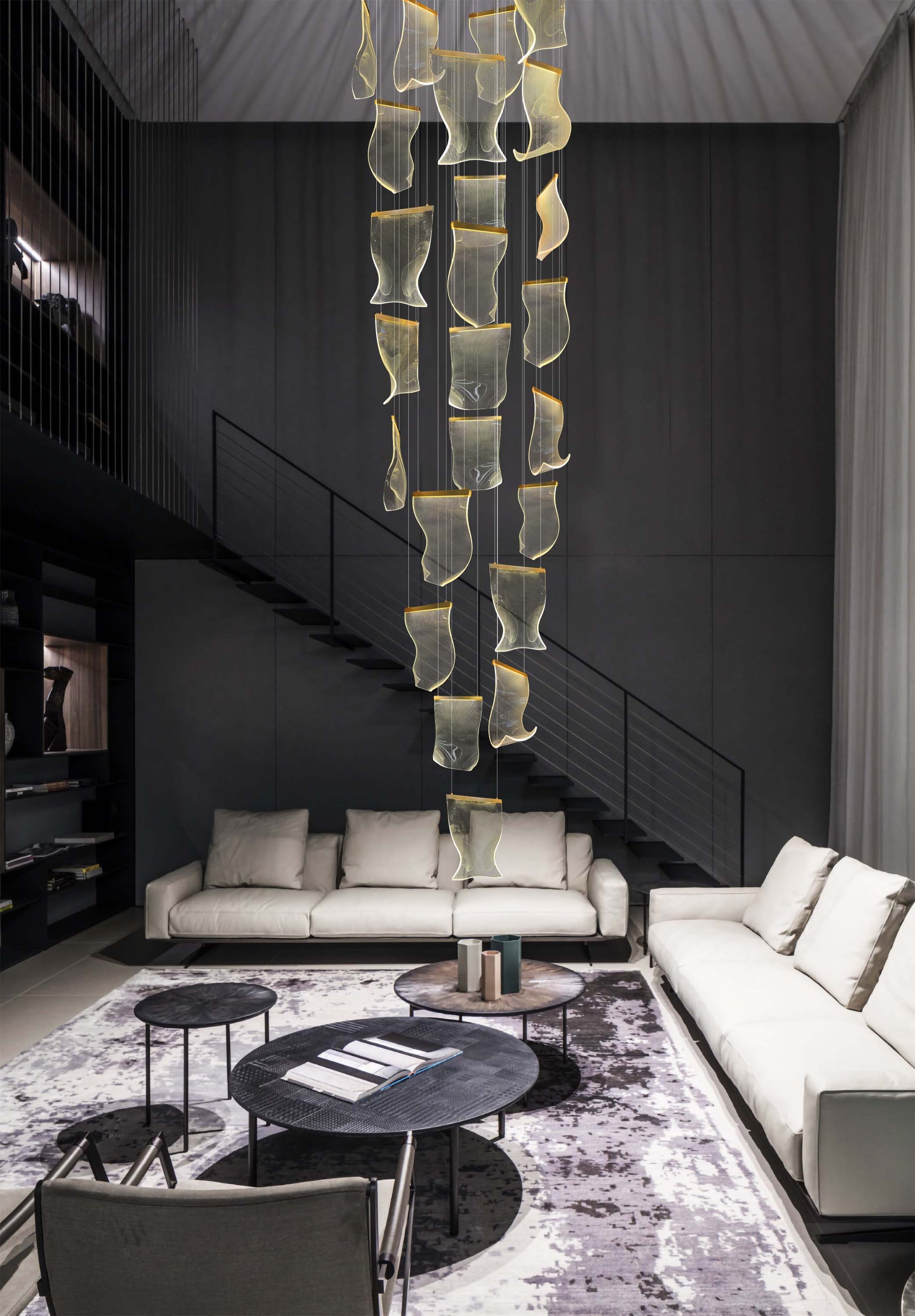 Adjustable dimmable gold chandelier with wave-shaped acrylic panels enhancing a refined modern interior.
