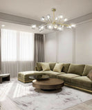 Brass crystal chandelier lighting a contemporary room in low ceiling 