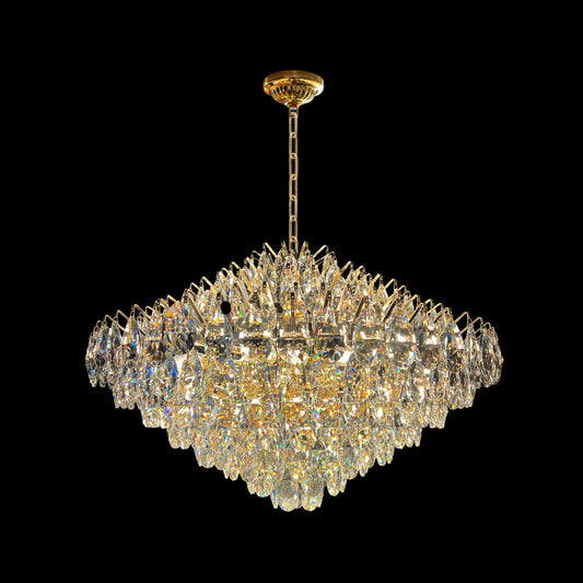 Close-up of champagne gold crystal teardrop chandelier with empire-style design.
