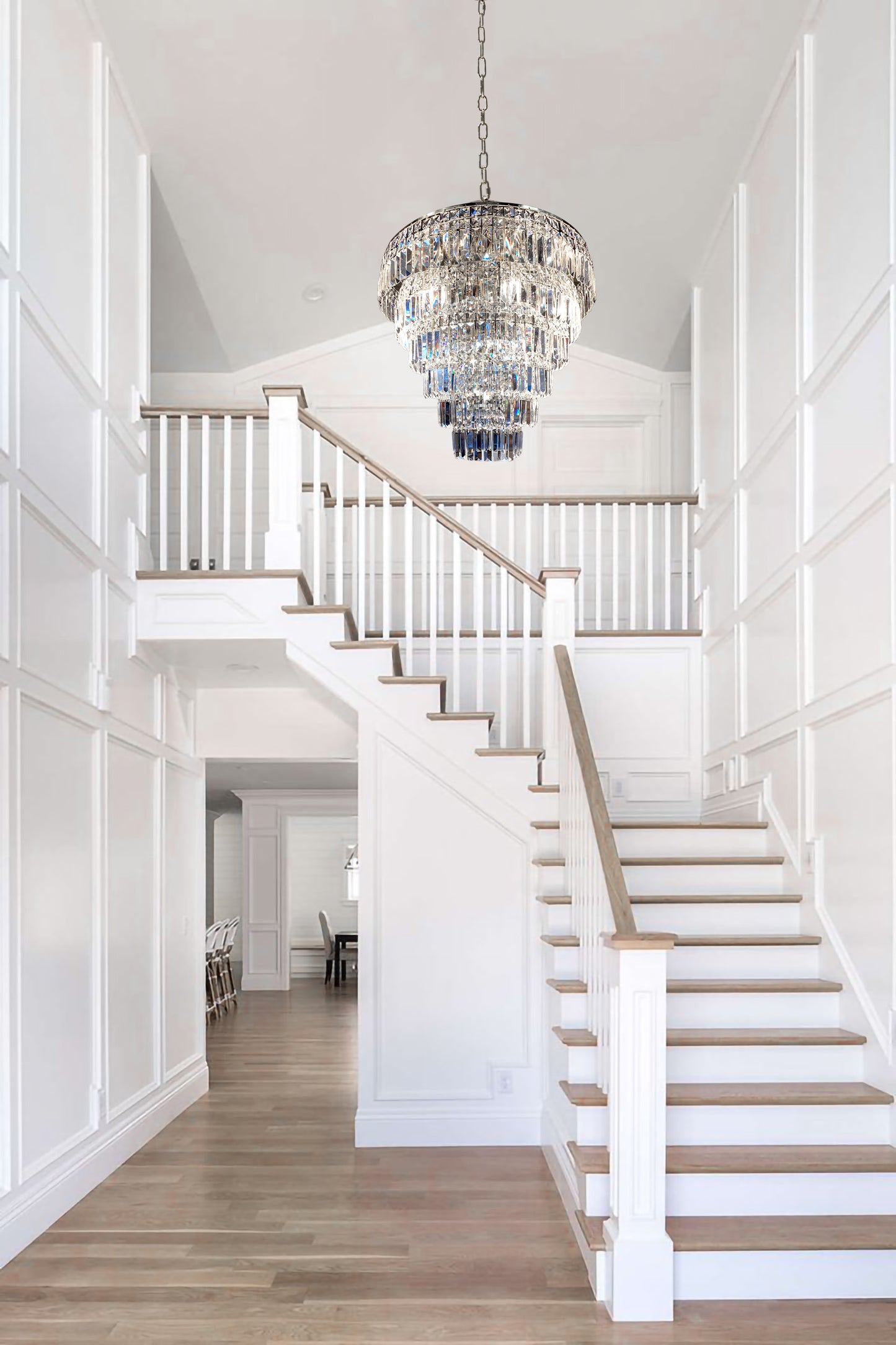  Elegant chrome chandelier installed in entryway with white walls