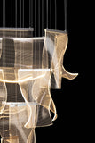 Chrome LED wave chandelier featuring adjustable hanging height and dimmable LED lighting for refined interiors.
