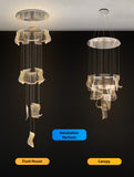 ide view showing the layered acrylic wave panels and cable suspension of the chrome LED chandelier.
