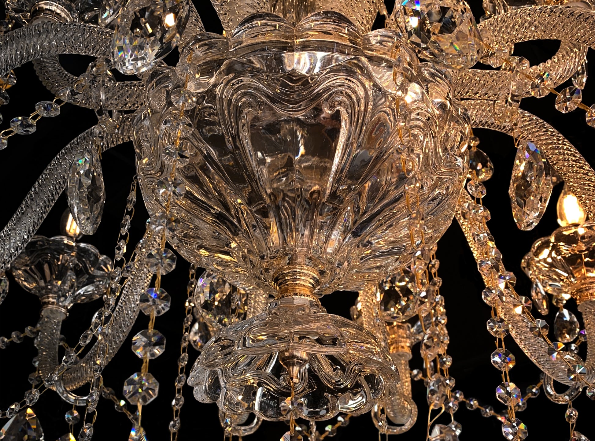 Gold-finish chandelier bottom mount with handcrafted crystal elements