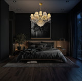 Italian-inspired gold chandelier with shimmering crystals and pleated shades for refined interiors.