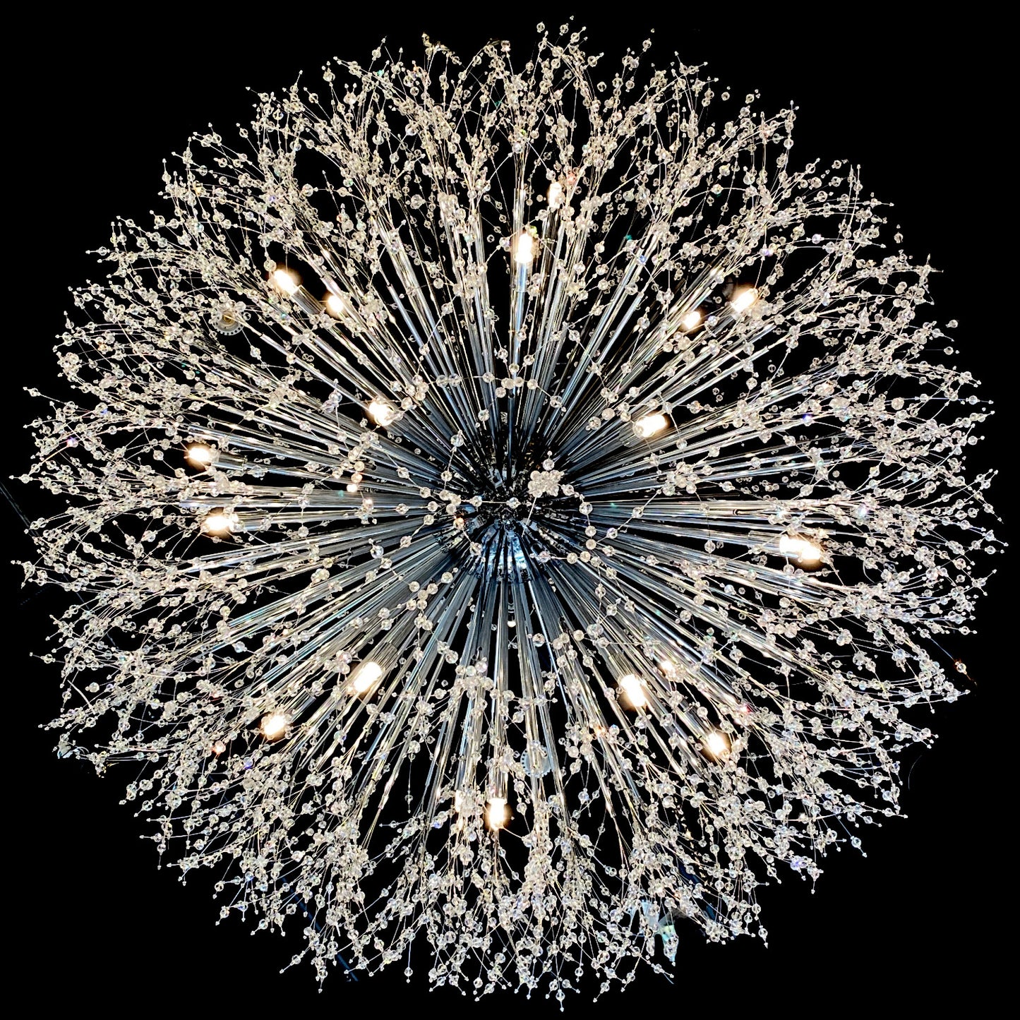 G4 halogen bulb warm white glow installed inn the starburst chandelier.