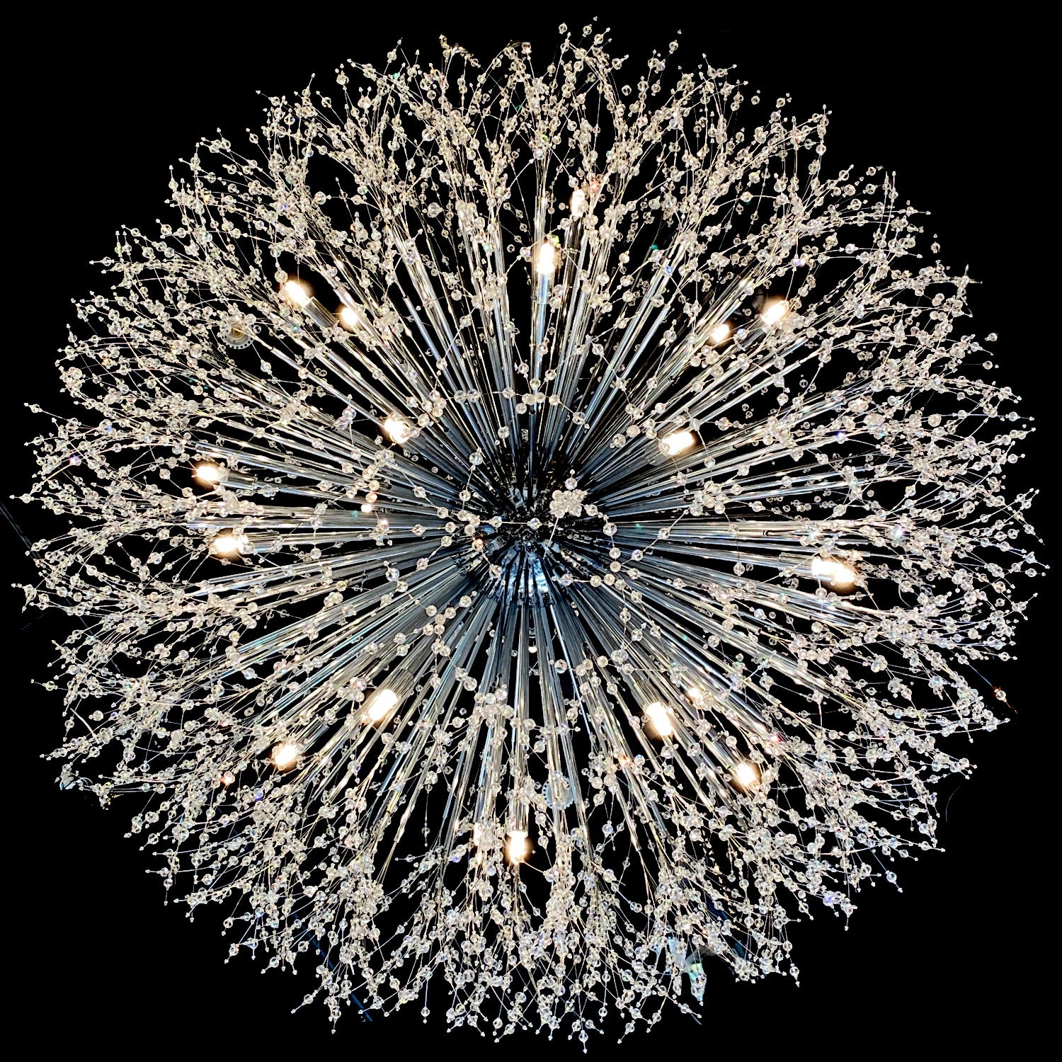 G4 halogen bulb warm white glow installed inn the starburst chandelier.