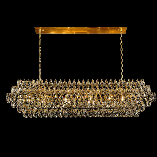 A luxurious 60-inch linear crystal chandelier featuring a polished gold frame and multiple tiers of precision-cut teardrop crystals, shown hanging from a rectangular canopy with dual chains against a solid black background.