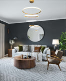 Contemporary multi-ring LED gold chandelier illuminating modern interior