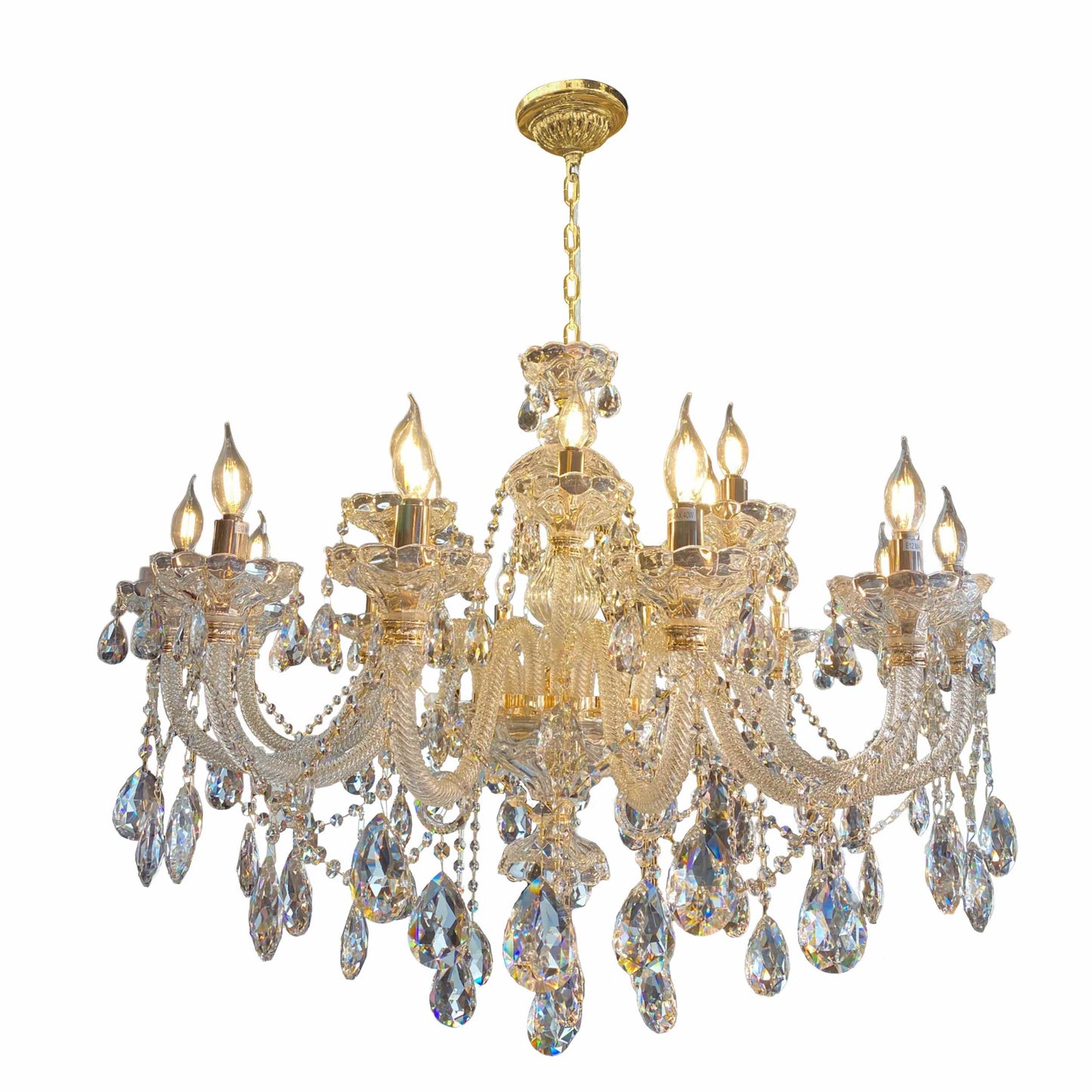 Full view of the gold crystal chandelier against a white background.
