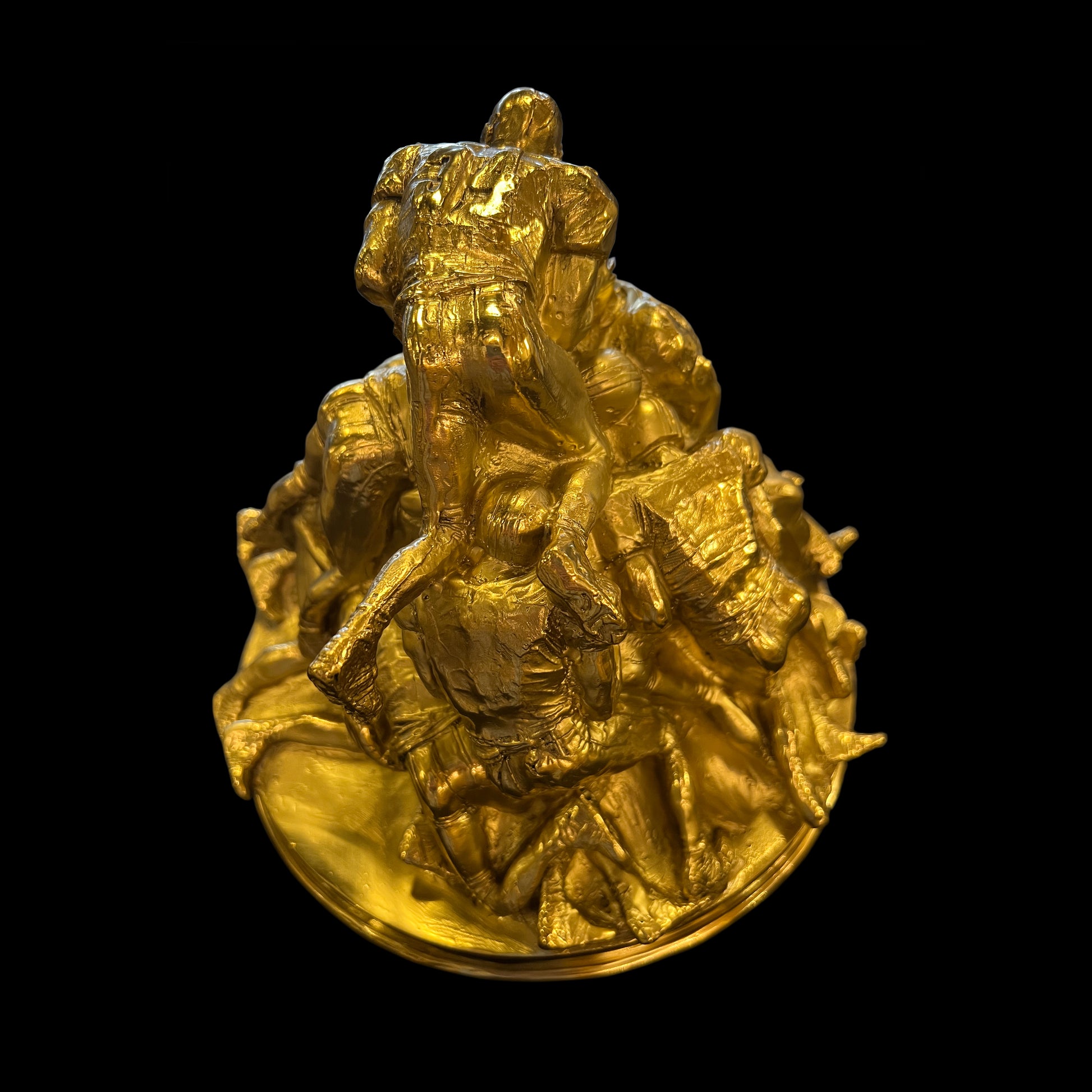  Top-down view of the luxury handmade Italian brass football sculpture showing the detailed craftsmanship.