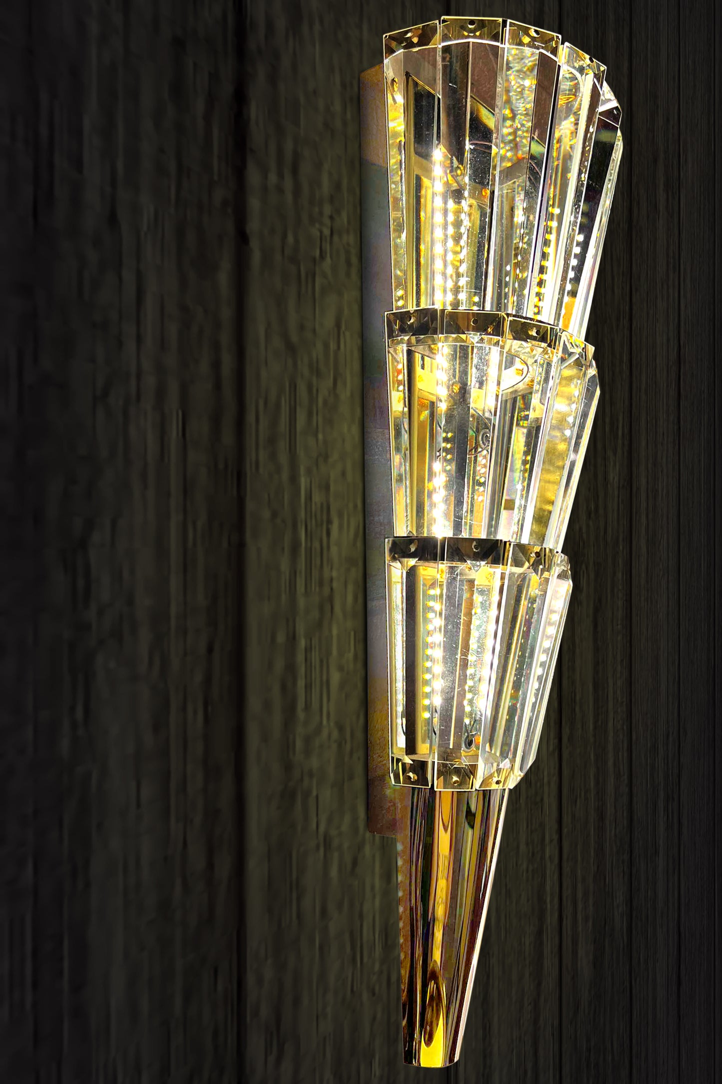 Crystal tapered wall sconce with warm gold finish