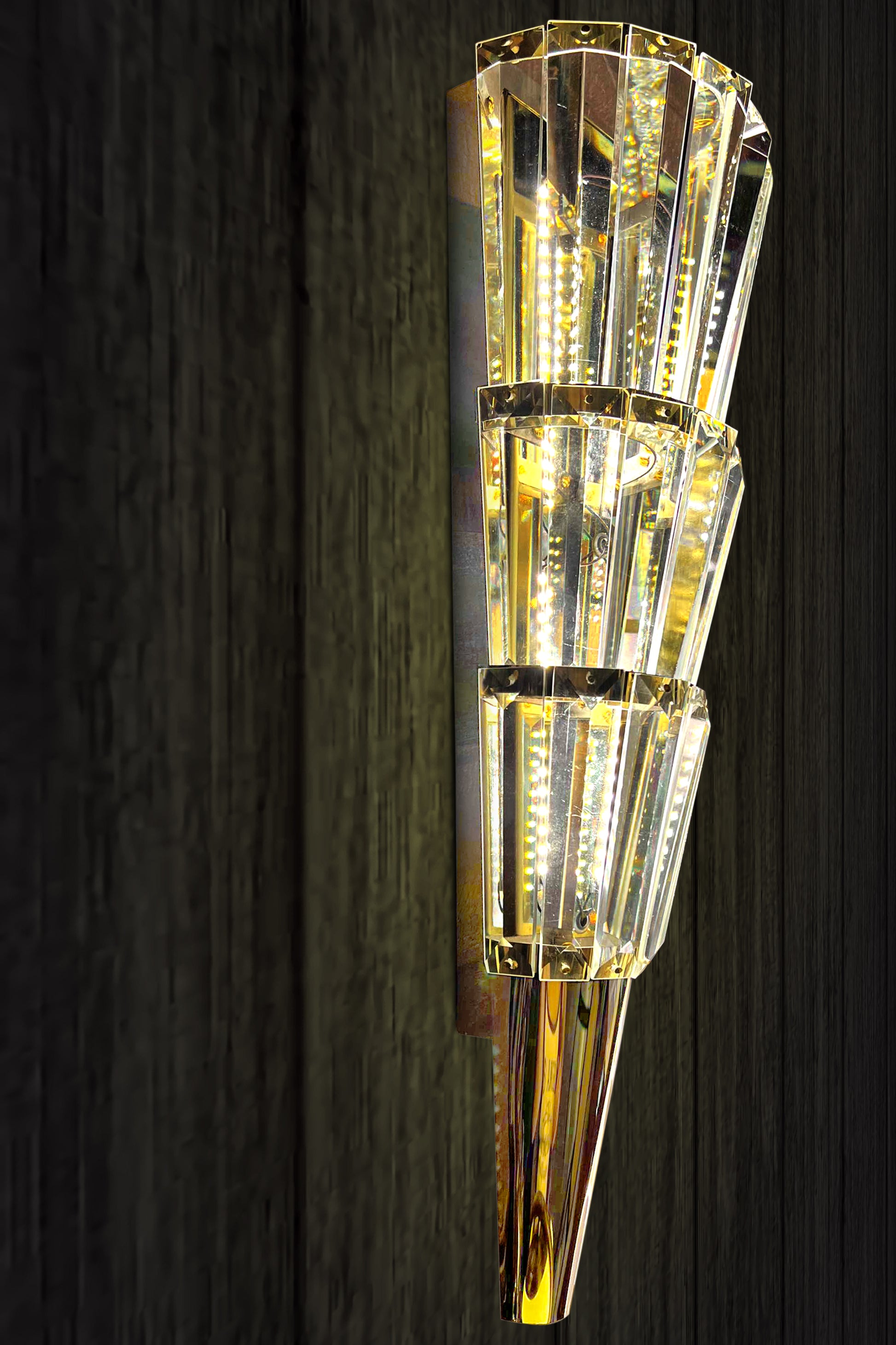 Crystal tapered wall sconce with warm gold finish