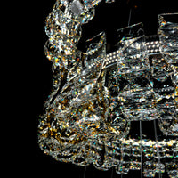 Close-up of a crystal chandelier against a black background