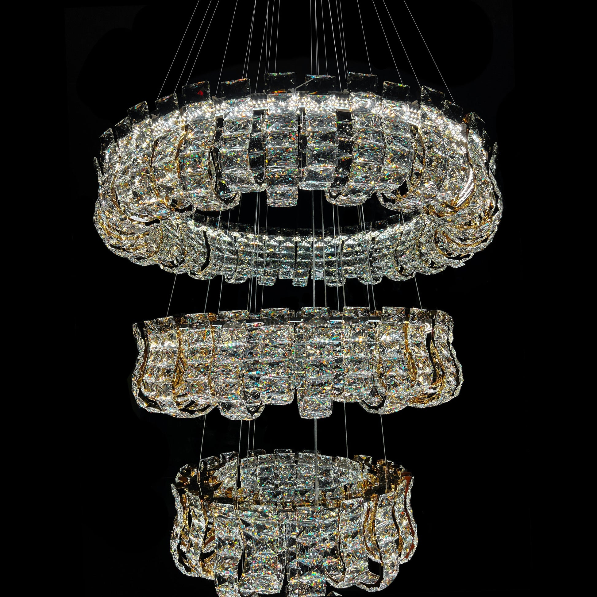 Crystal chandelier with multiple tiers on a black background