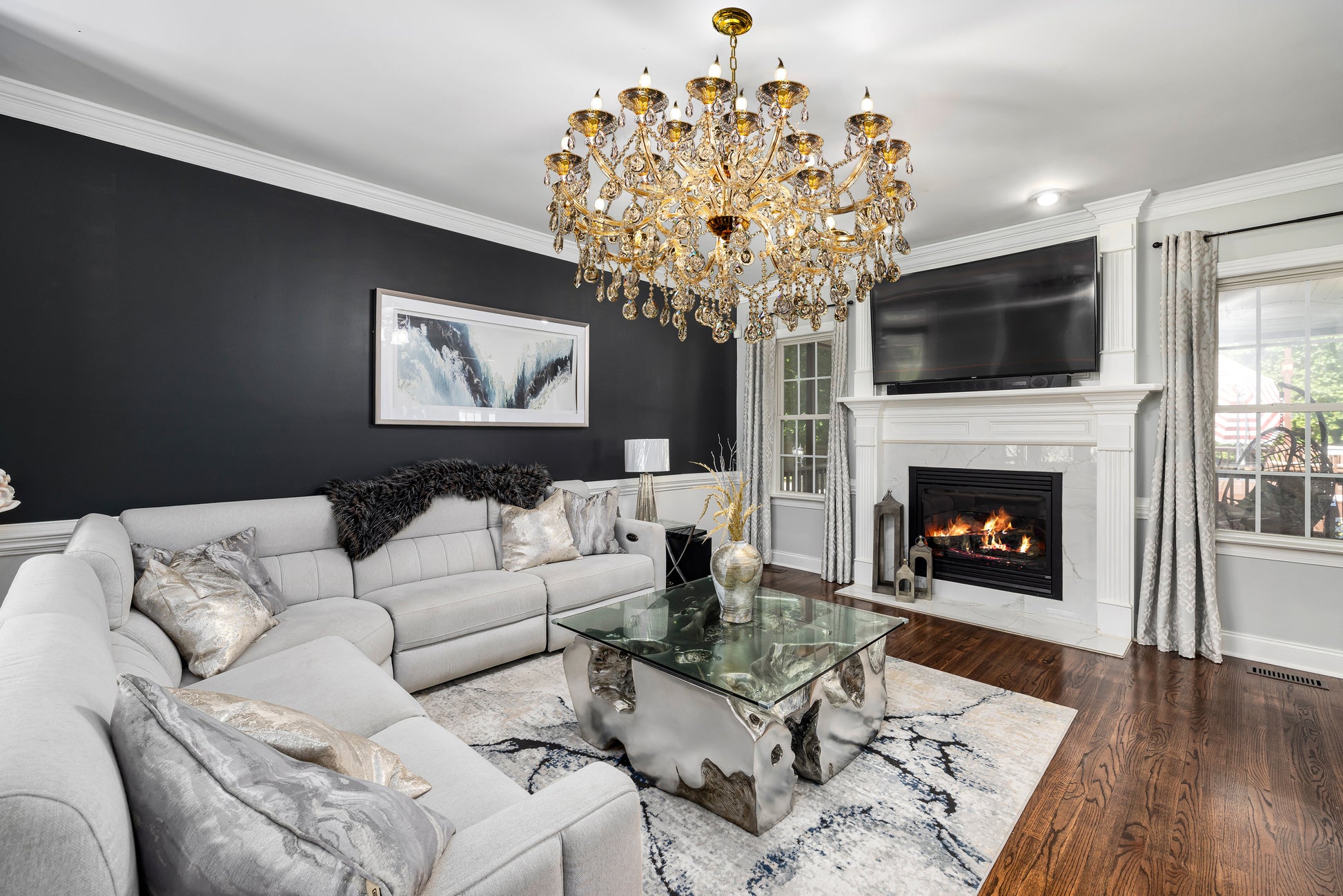 45-inch Maria Theresa gold chandelier styled in luxury living room

