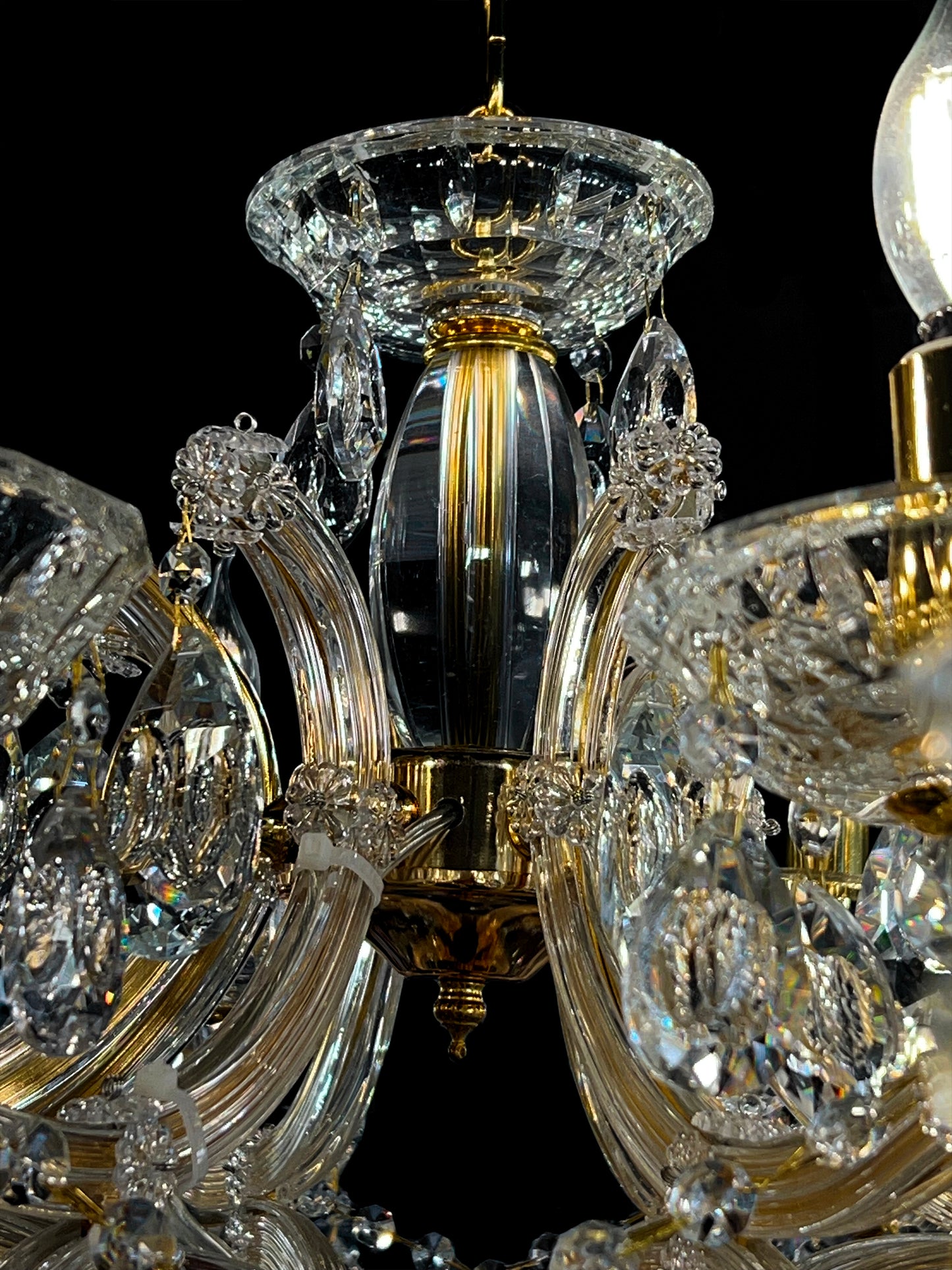 Maria Theresa gold crystal chandelier ornate center detail
