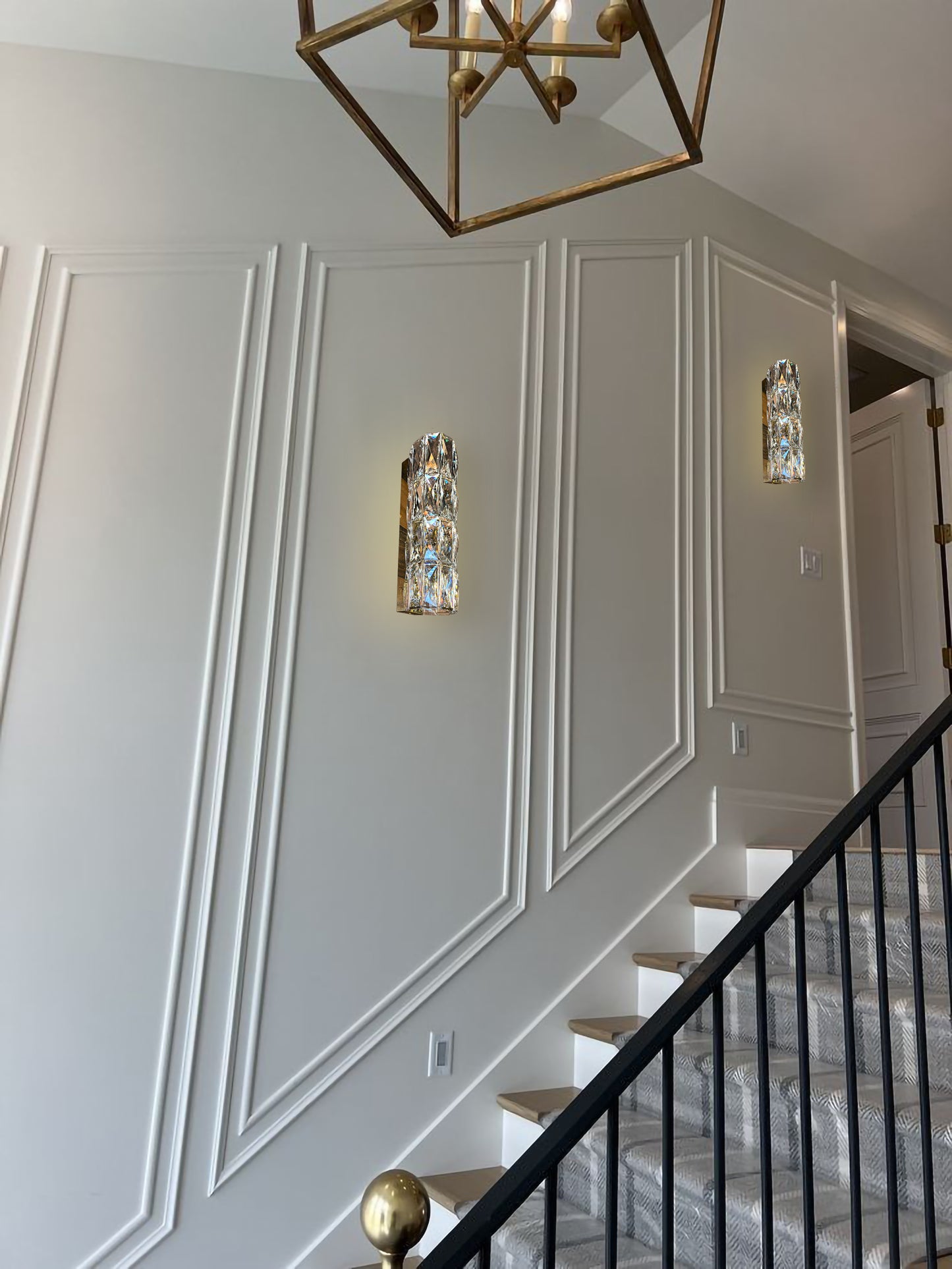 Slim LED wall sconce along luxury staircase
