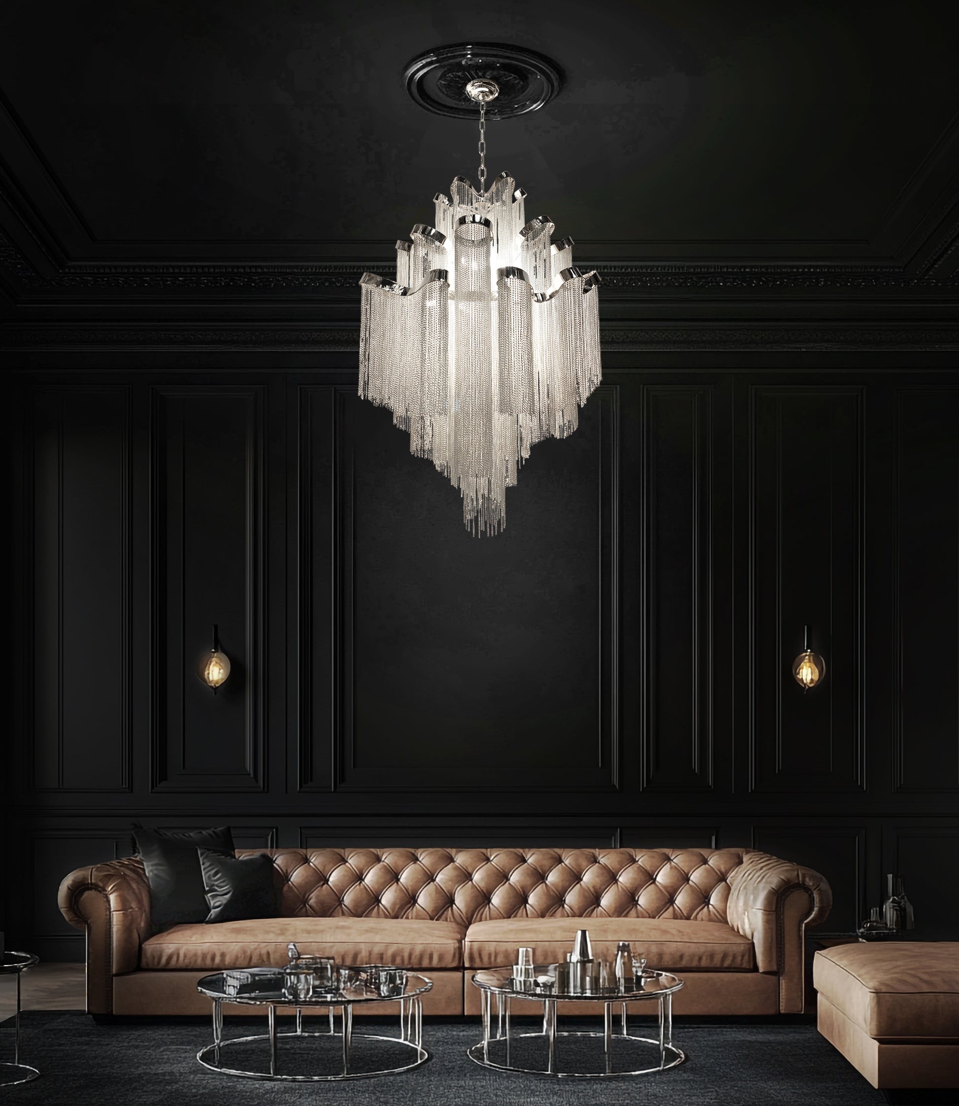 Luxury chrome waterfall chandelier suspended above a brown leather sofa in a designer modern living space.
