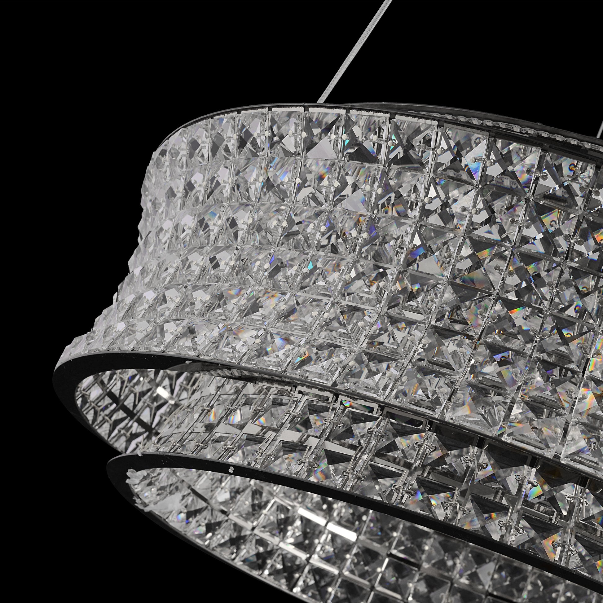 Angled view of modern crystal LED chandelier showcasing reflective chrome and crystal surfaces.