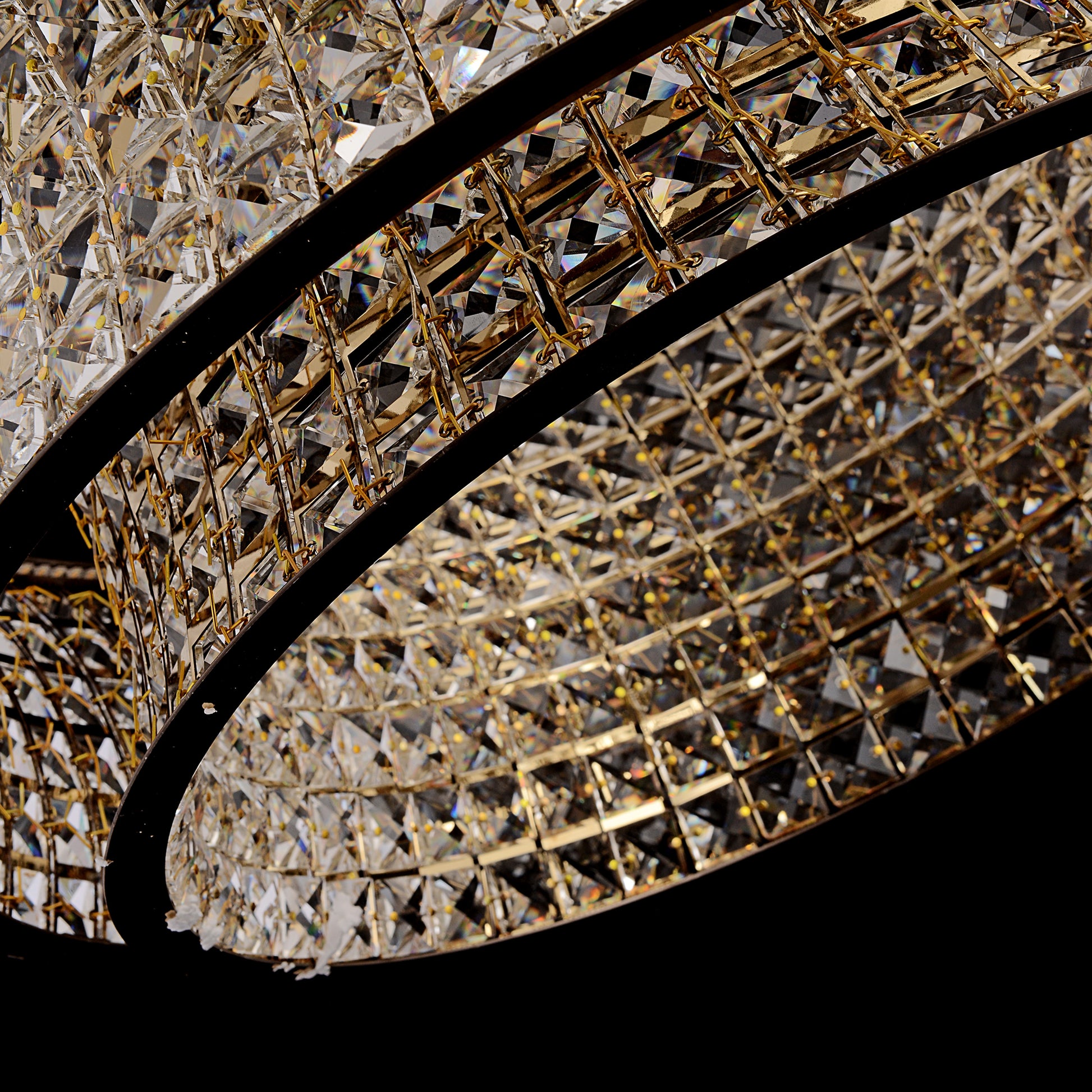 Bottom perspective of crystal chandelier revealing multi-faceted crystal brilliance and depth.