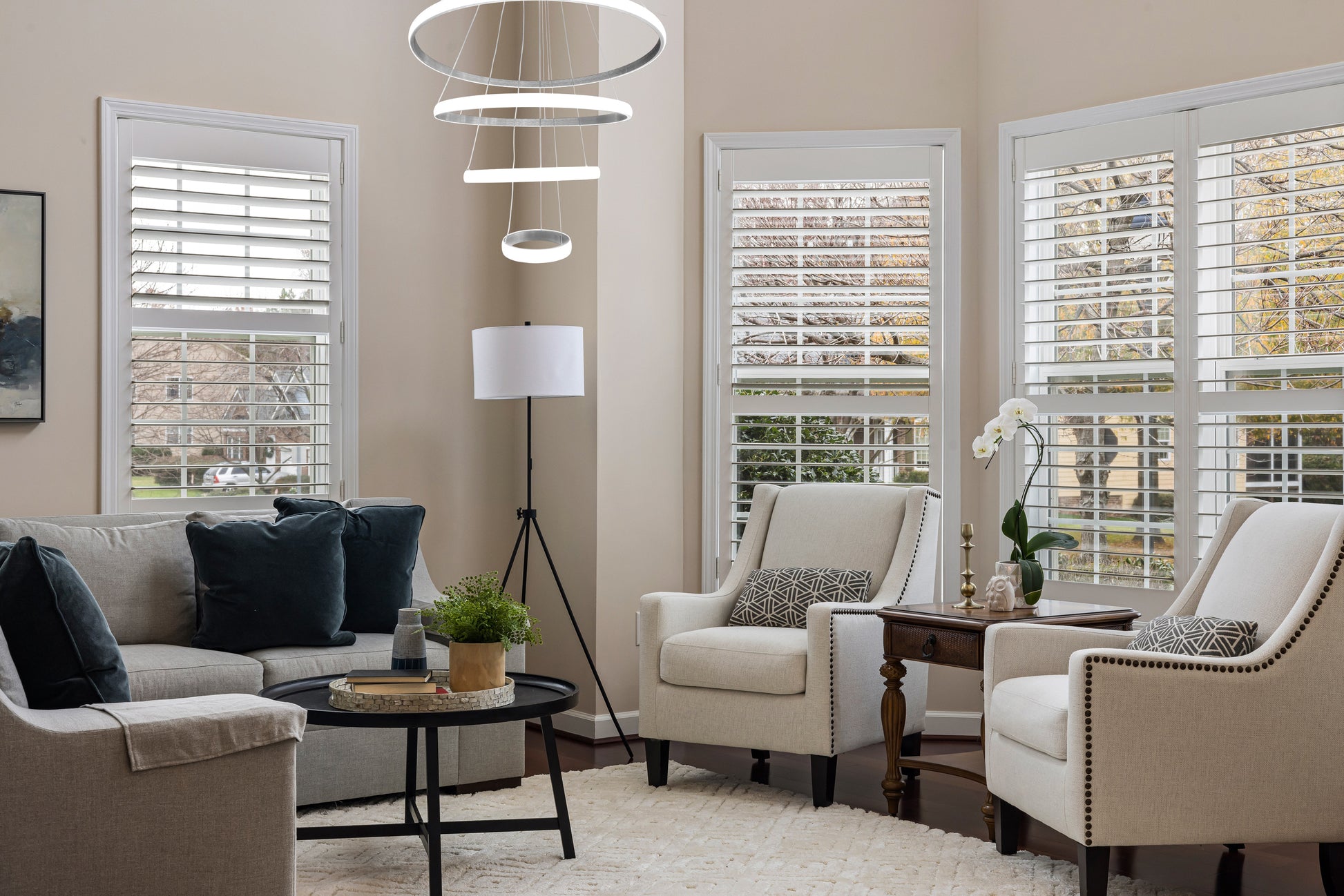 LED ring chandelier in brushed nickel installed in living room