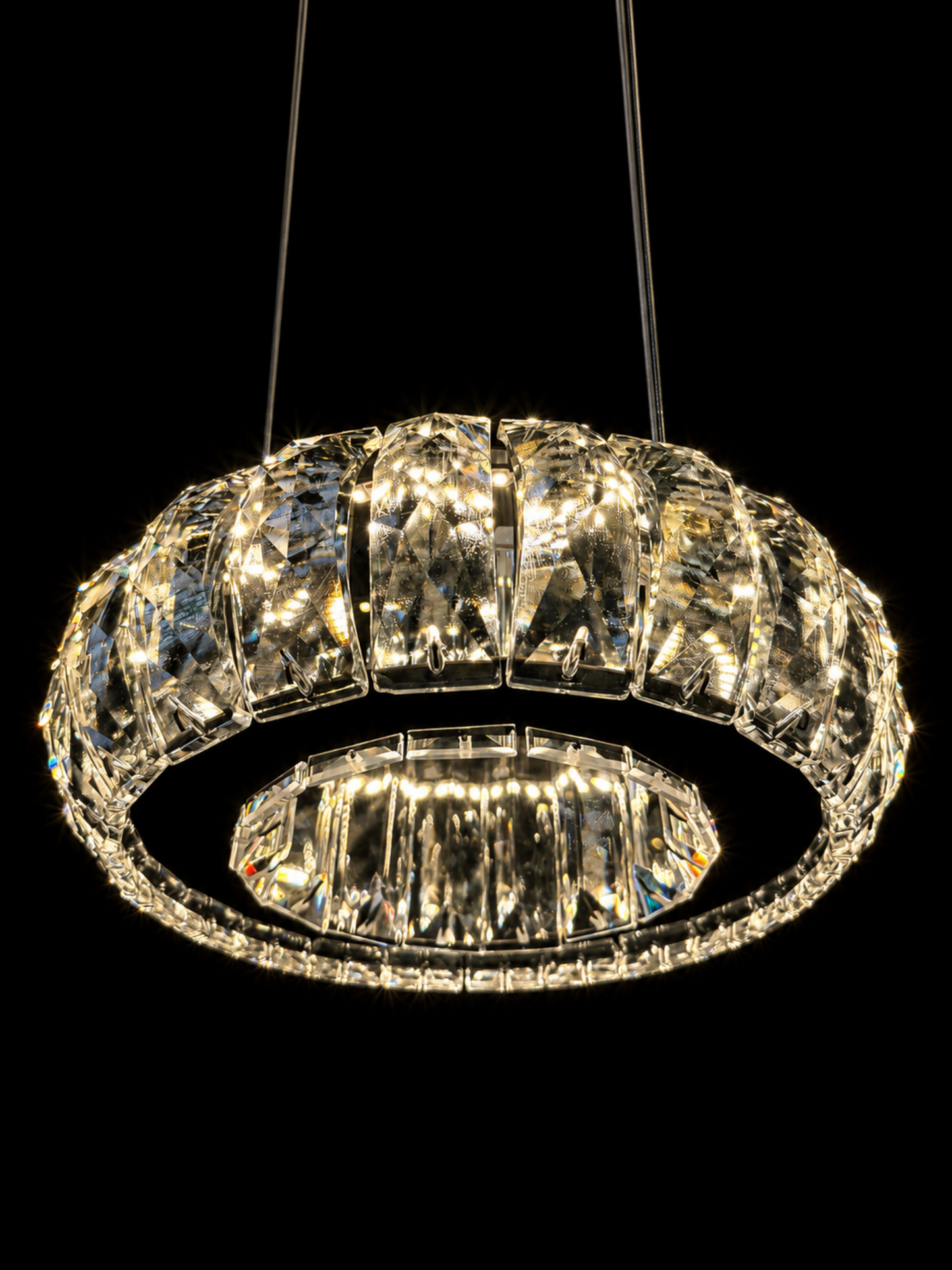 Cascading silver crystal ring chandelier viewed from angled perspective
