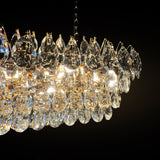 Close-up view of the champagne gold rectangular crystal chandelier showing premium teardrop K9 crystals and golden frame detail