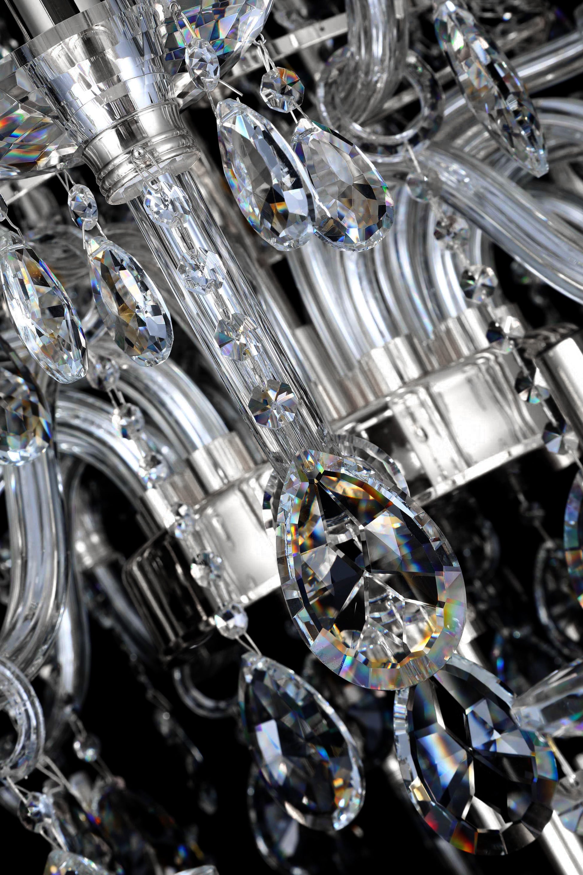 Detailed chrome chandelier arm with sparkling precision-cut crystals and reflective clarity
