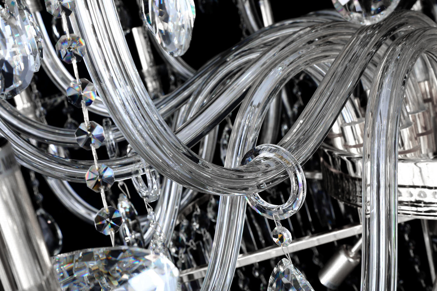 Detailed view of curved crystal arms and polished chrome frame for radiant reflection.