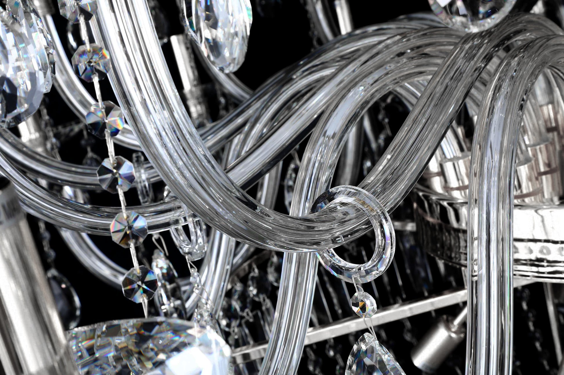 Detailed view of curved crystal arms and polished chrome frame for radiant reflection.