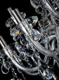 Precision-cut crystal detailing of chrome chandelier showcasing light refraction and clarity.