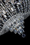 Bottom view of multi-tier chrome crystal chandelier with cascading crystal strands