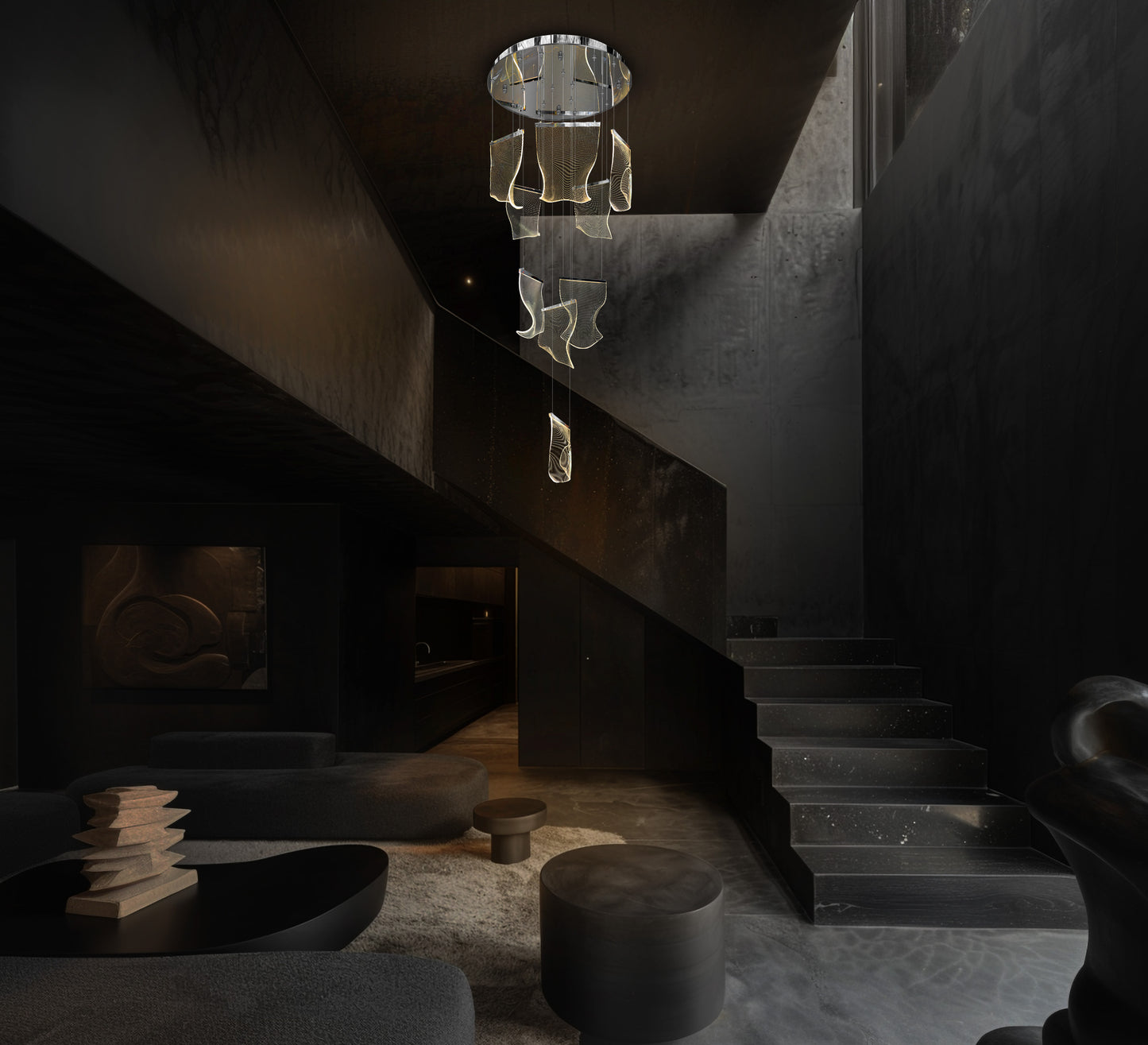 Chrome LED chandelier direct ceiling  installed above dark modern living spaced with  staircase 
