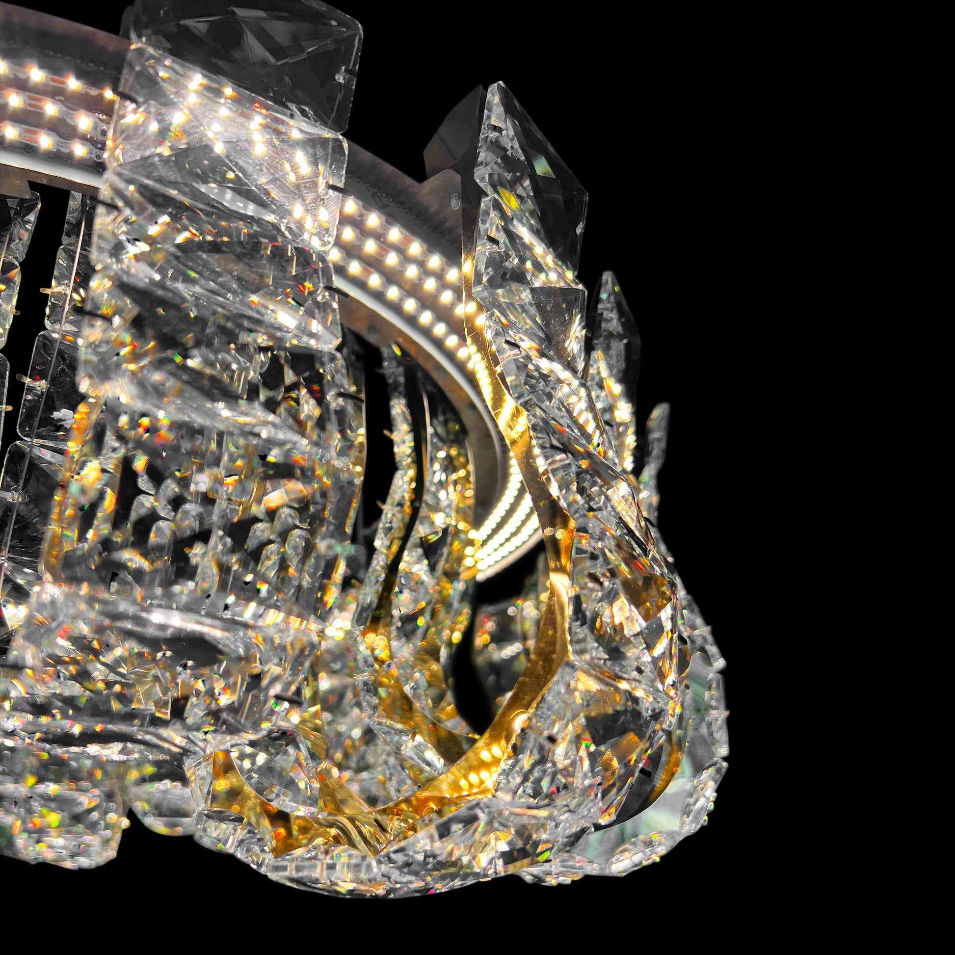 Close-up view of premium K9 crystal detailing on the luxury gold chandelier showing clarity and brilliance