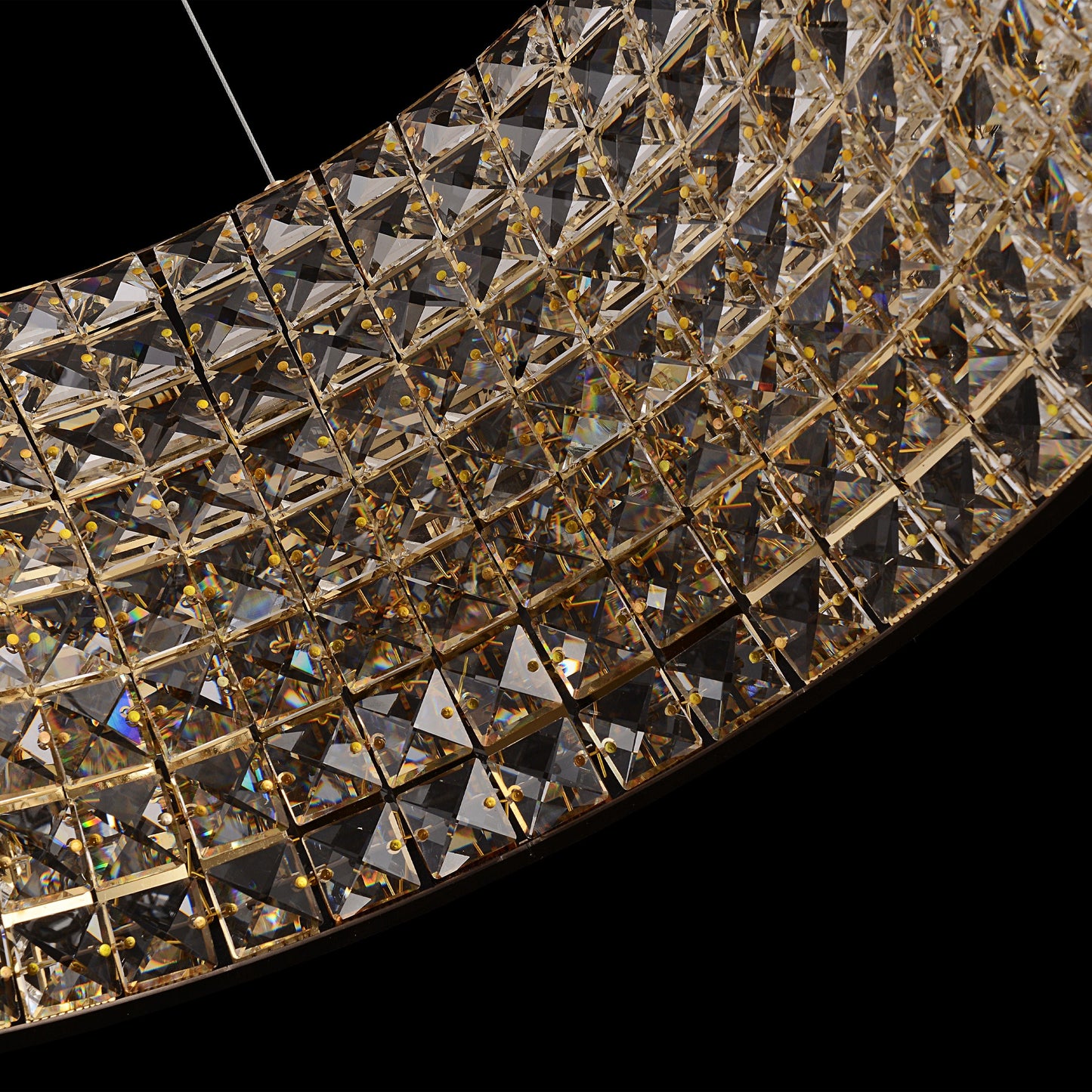 Side angle view of  gold crystal LED chandelier with suspended double-ring crystal layers.