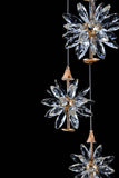 Close up of clear crystal clusters on modern gold LED cascading chandelier