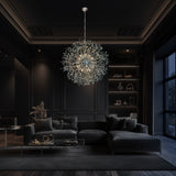 A modern dimmable chrome pendant light fixture with a starburst design, featuring crystal spikes, hanging over a stylish living room setting with a dark interior.