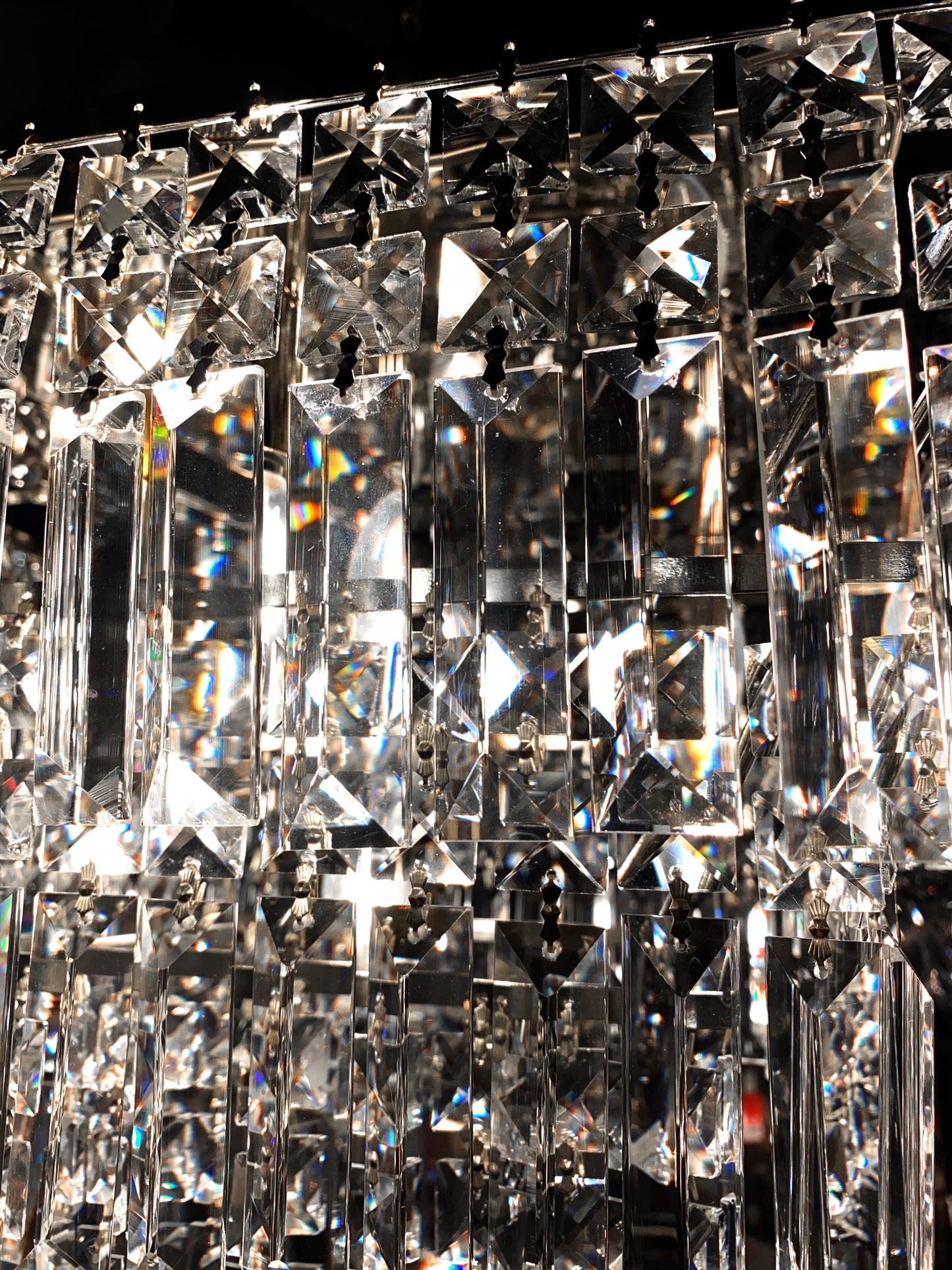 Close up detail of chrome crystal chandelier premium prisms