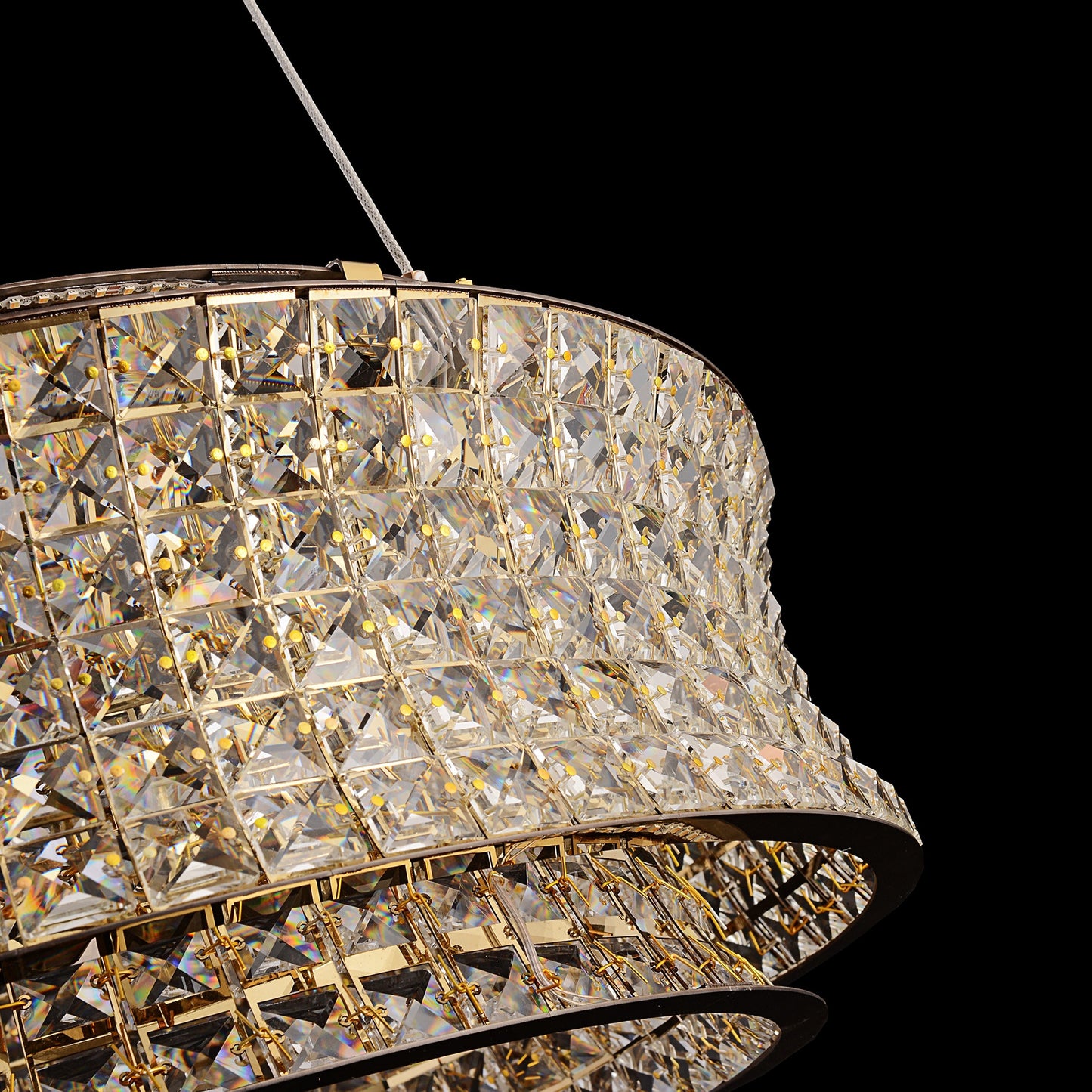 Close-up detail of curved crystal ring showing intricate faceted crystal design.