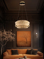 LED chandelier illuminating a contemporary living room over sofa