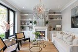 Luxury gold starburst chandelier styled in a bright modern living interior