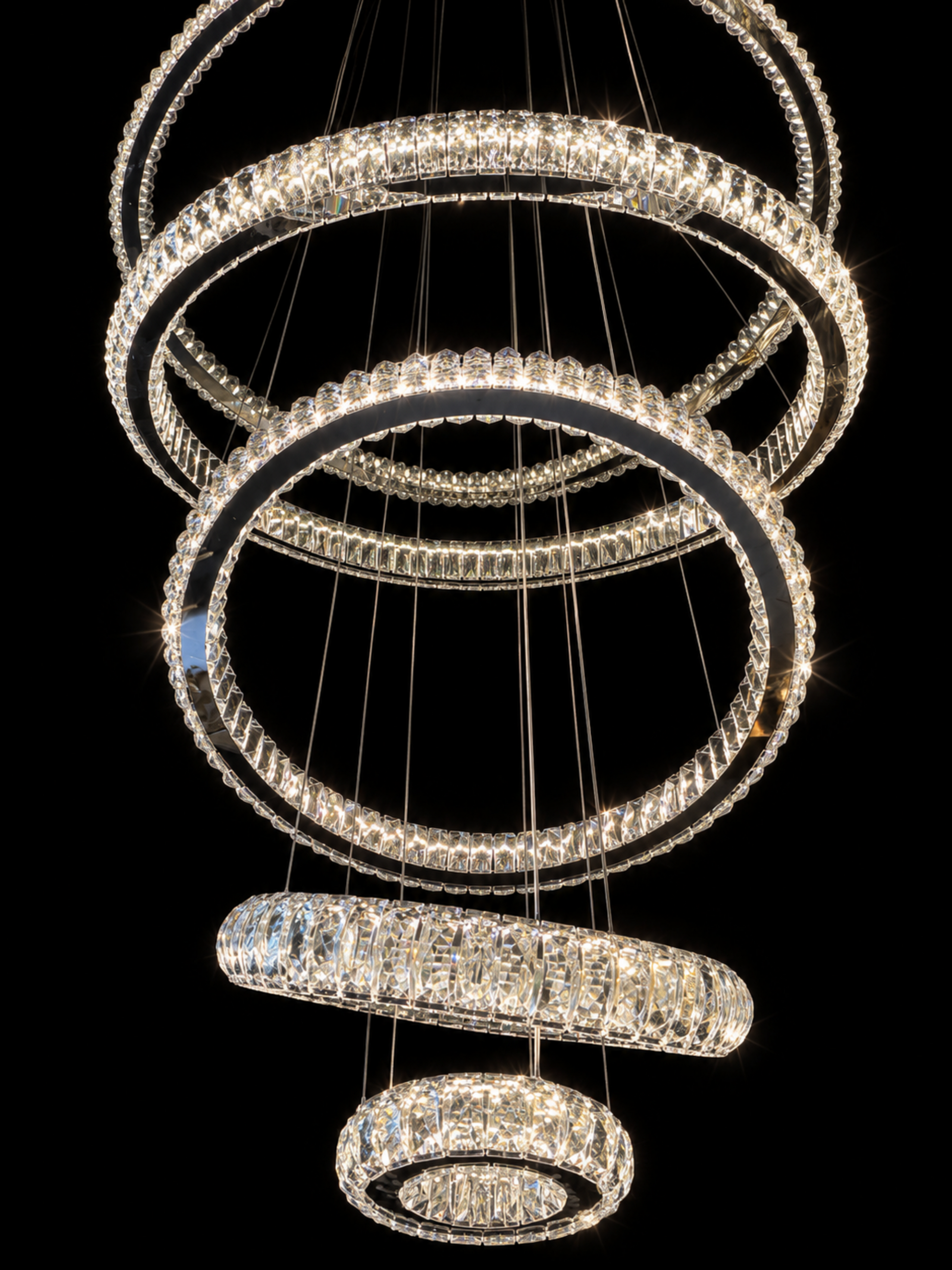 Floating multi-tier crystal ring chandelier with polished silver finish
