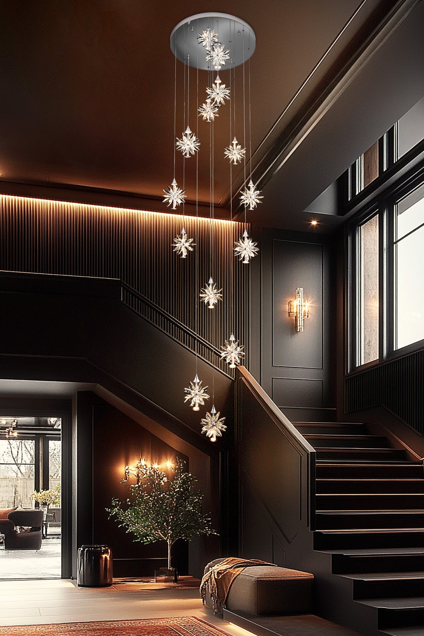 Tall LED spiral crystal chandelier lighting a modern foyer and staircase