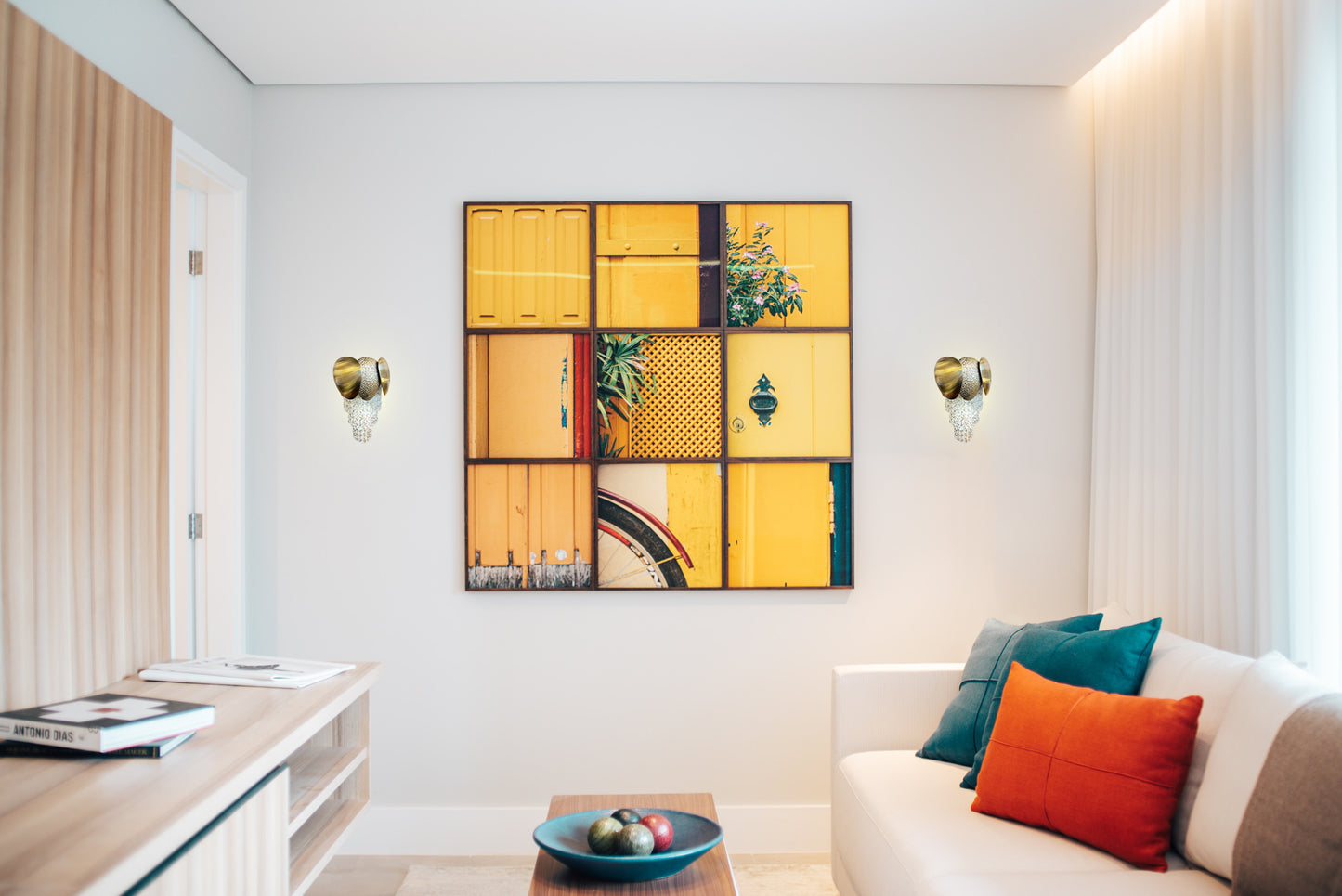 gold wall sconce in bright contemporary living space